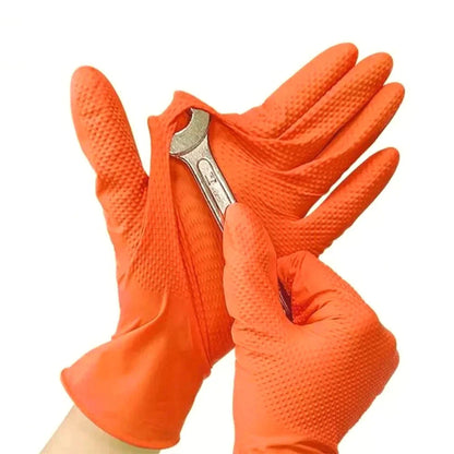 Orange gloves holding a wrench on a white background