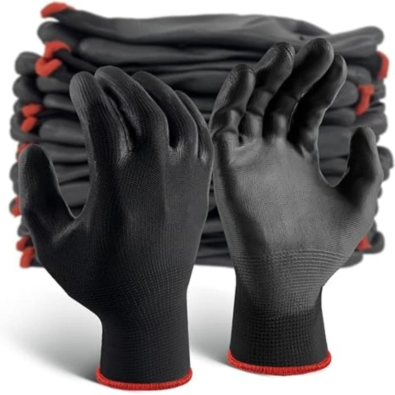 Pair of black gloves with red accents in front of a stack of similar gloves.